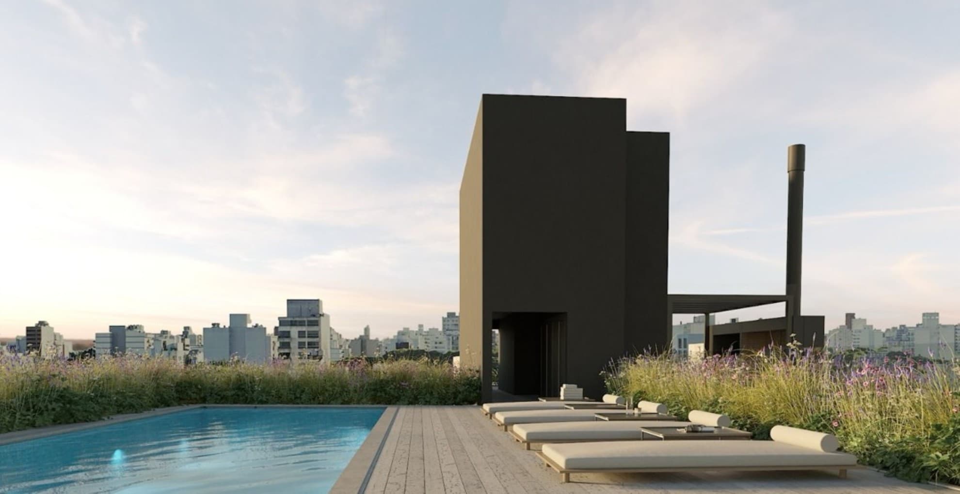 Terraza con pileta sobre los techos de Palermo al atardecer, en un emprendimiento de Migliorisi